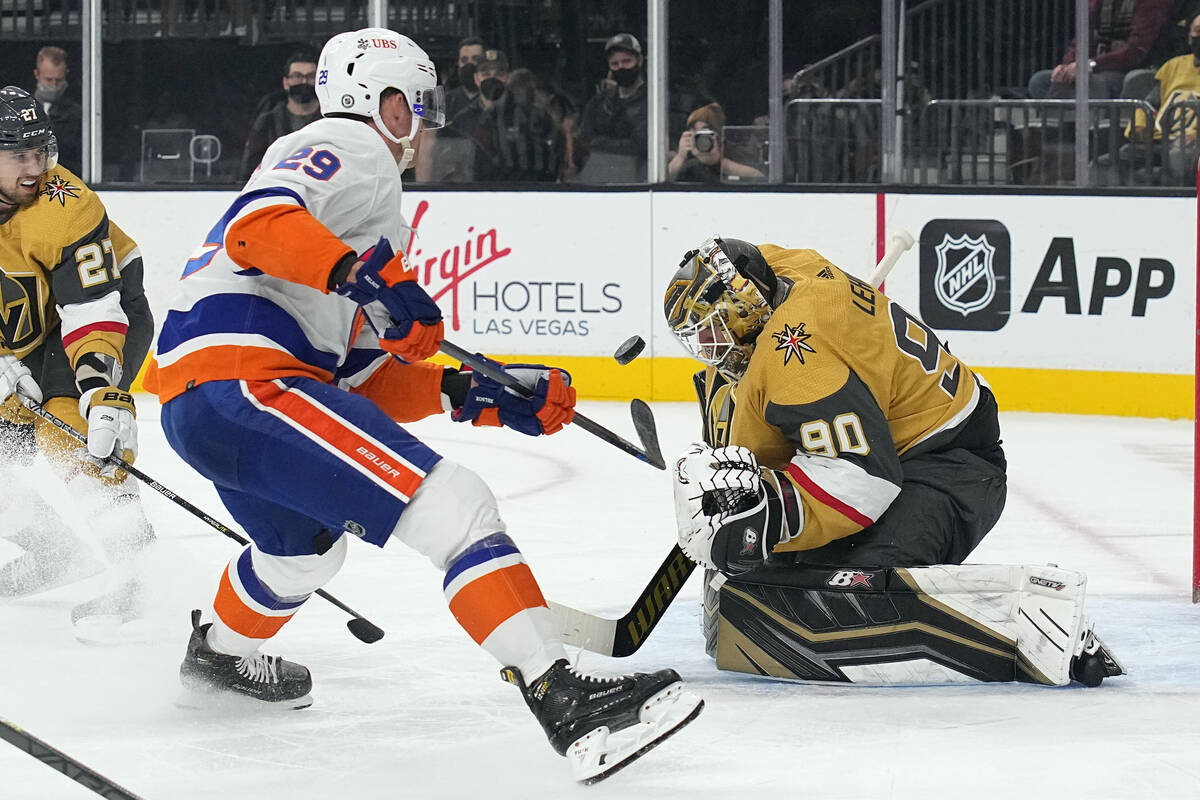 Vegas Golden Knights goalie Robin Lehner (90) makes a save against New York Islanders center Br ...