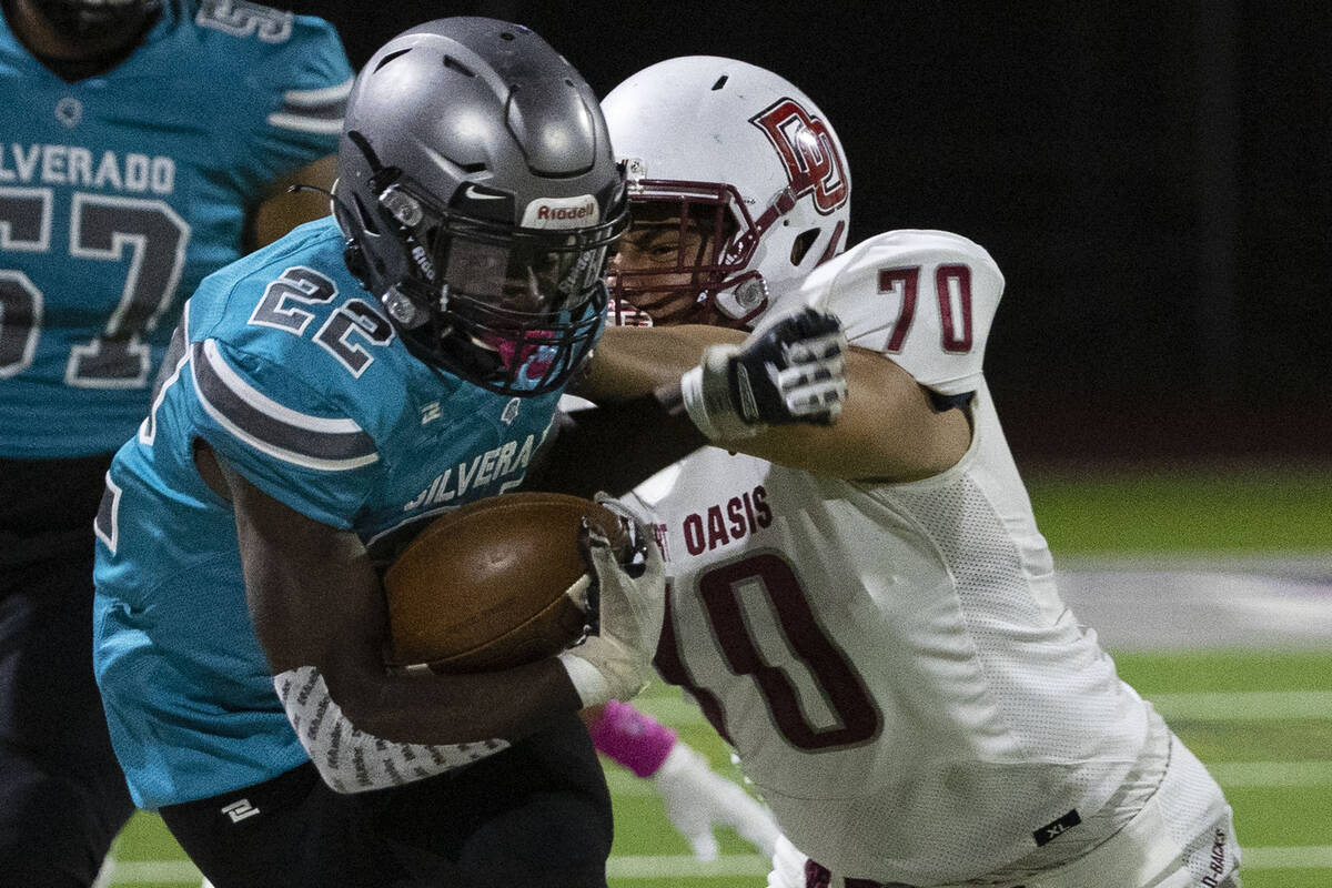 Desert Oasis defensive tackle Matthew Toeaina (70) defends against Silverado HighÕs runing bac ...