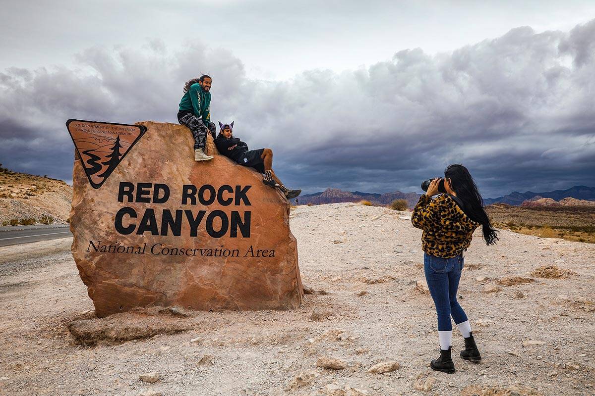 Marilyn Leiva, of California, takes a photo of her boyfriend Jonathan Romo, left, and his broth ...