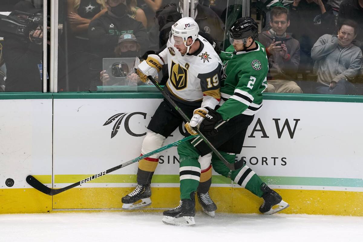 Vegas Golden Knights right wing Reilly Smith (19) and Dallas Stars defenseman Jani Hakanpaa (2) ...