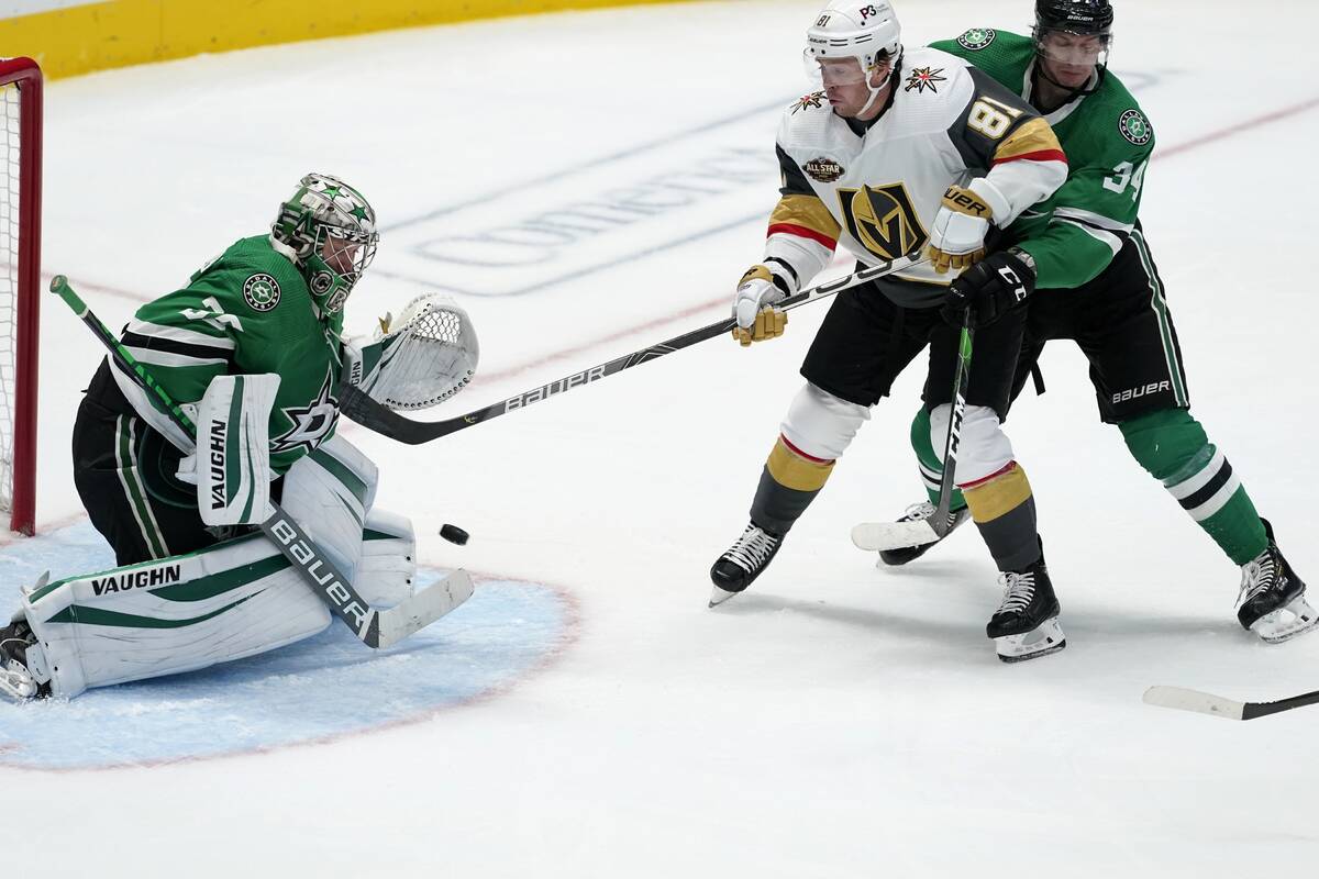 Dallas Stars goaltender Anton Khudobin (35) blocks a shot as right wing Denis Gurianov (34) hel ...