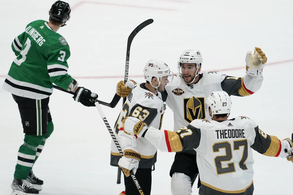 Dallas Stars' John Klingberg (3) skates past as Vegas Golden Knights' Evgenii Dadonov (63), She ...