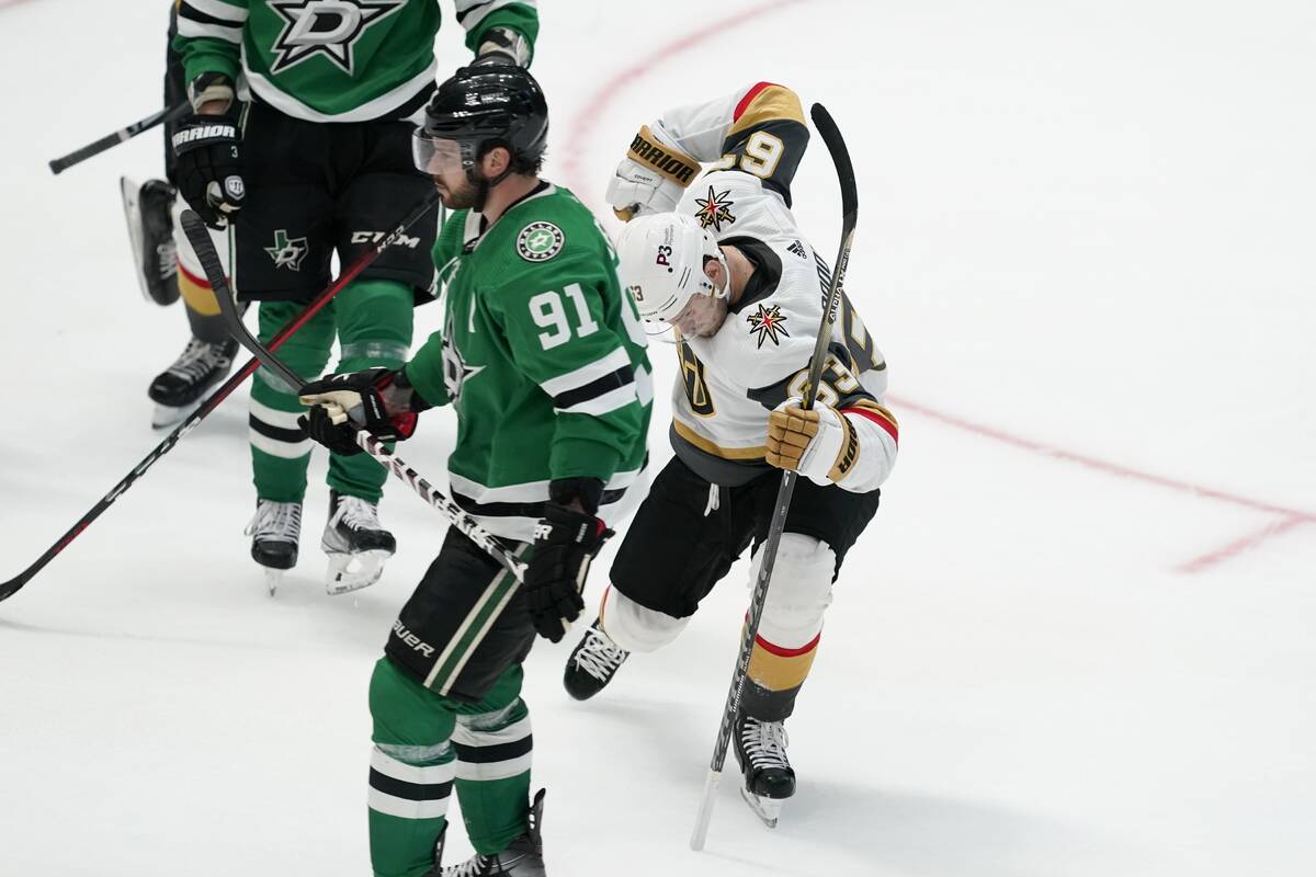 Dallas Stars center Tyler Seguin (91) skates past as Vegas Golden Knights' Evgenii Dadonov (63) ...