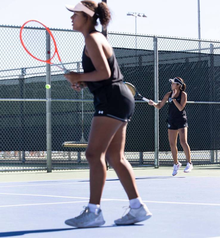 Palo HighÕs Jessica Bernales returns the ball as Paisha Douglas, left, looks on during Cla ...