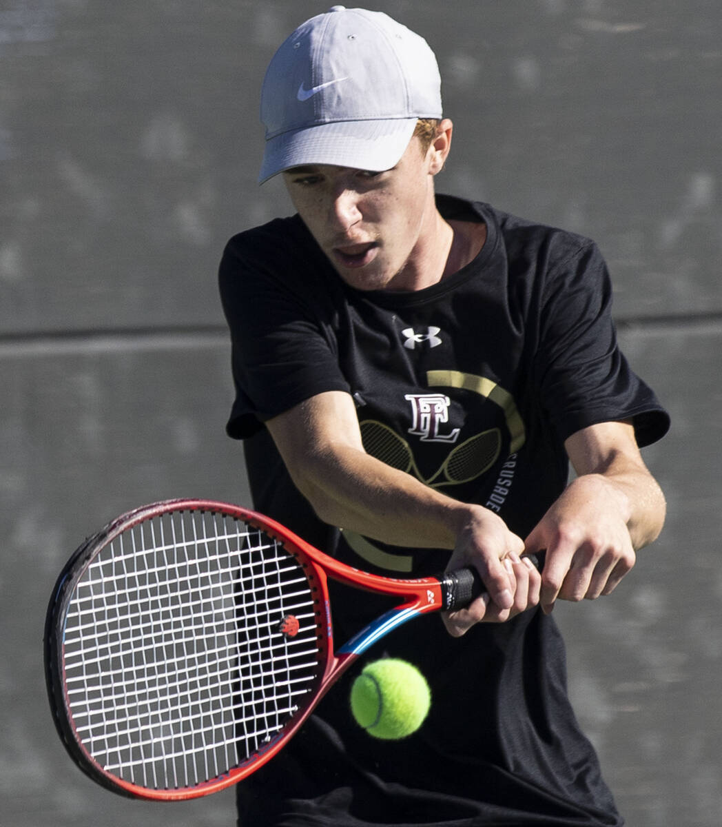 Faith LutheranÕs Nolan Dubay returns the ball against Palo HighÕs Jonas Santos during ...