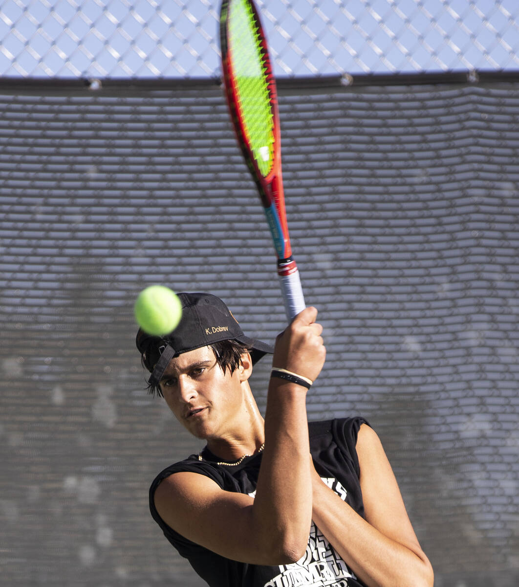 Faith LutheranÕs Kenny Dobrev returns the ball against Palo HighÕs Bronson Desisto du ...