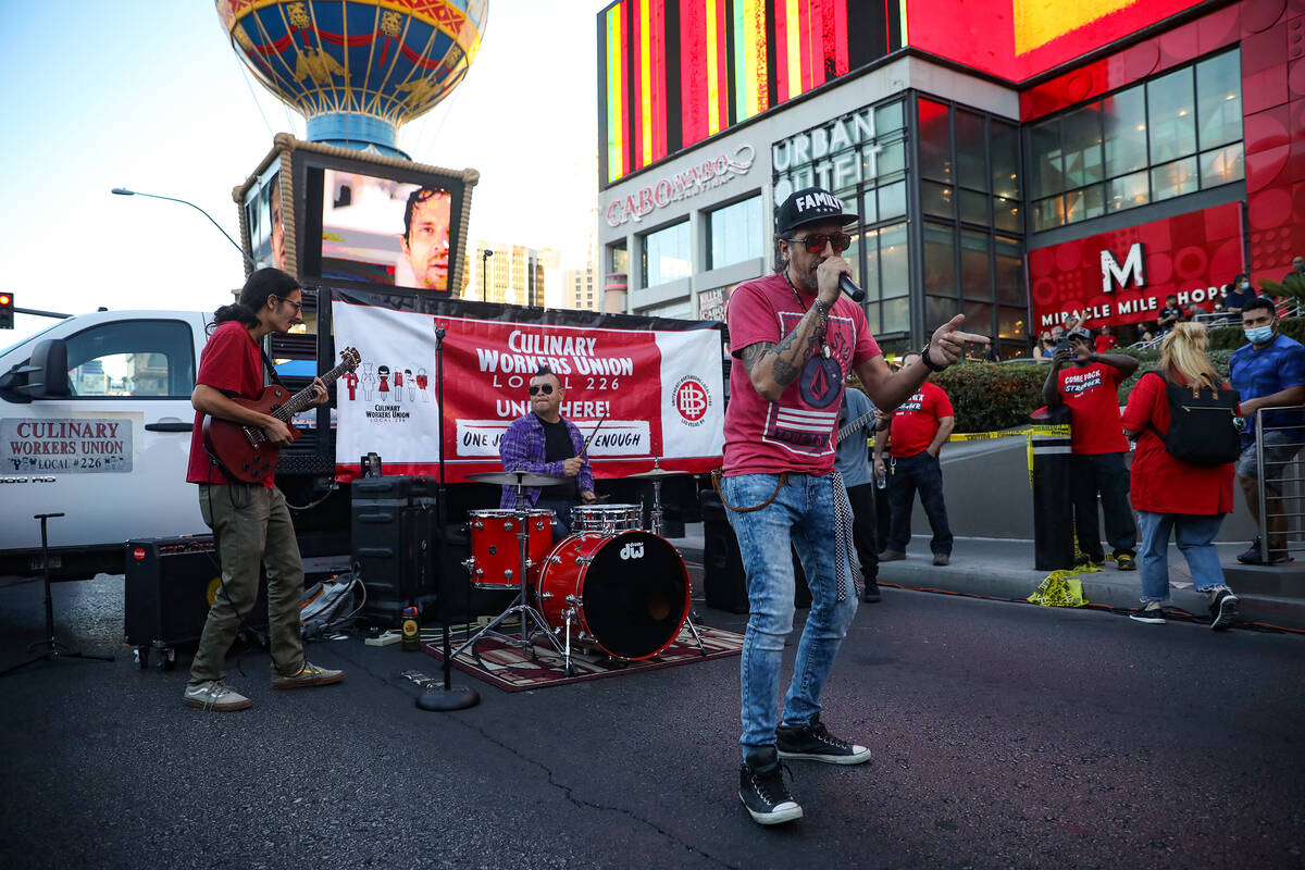 Felipe Arellano, lead singer of the ska band Skanky Banks, entertains the crowd at a rally of t ...