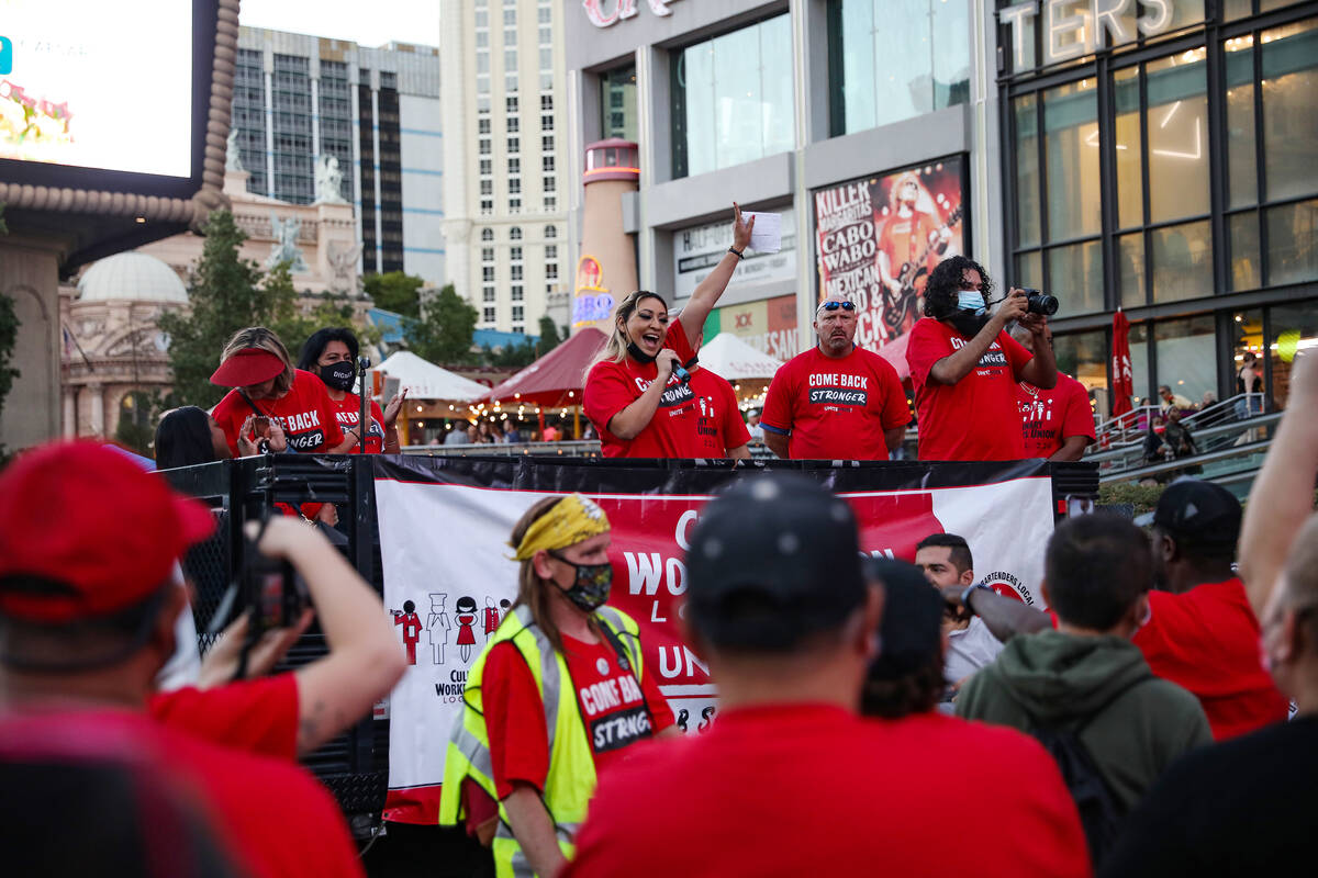 Elizabeth Renteria, a guest room attendant for Caesars Palace, addresses the crowd at a rally ...