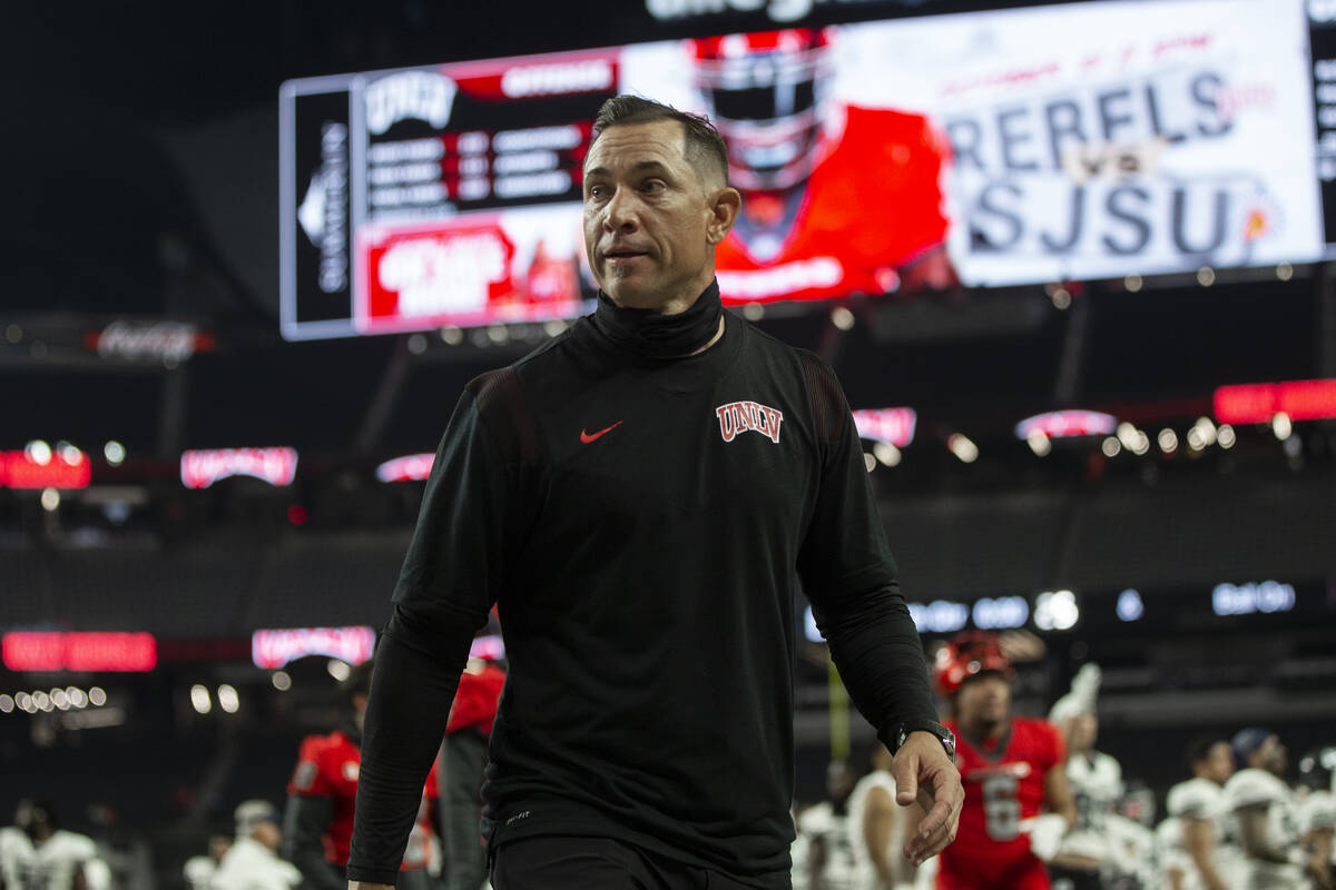 UNLV Rebels head coach Marcus Arroyo walks off the field after losing to Utah State at the end ...