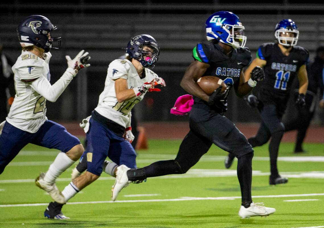 Green Valley running back Jaylen Mcknight (6) runs past Foothill defenders on an 82 yard touchd ...