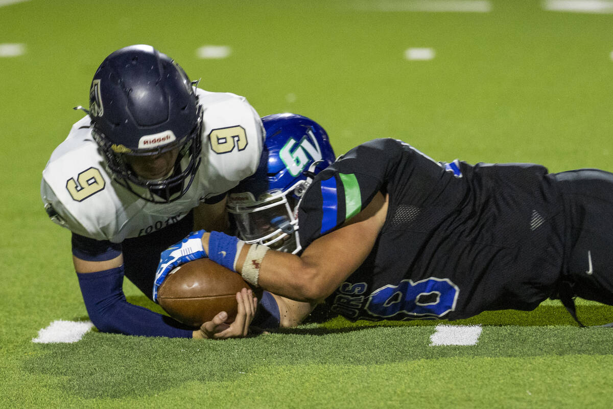 Foothill quarterback Jack Thow (9) recovers a loose ball as Green Valley defensive end Eric Sho ...