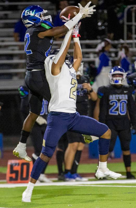 Green Valley receiver Justyn Delzeit (12) has a pass broken up by Foothill cornerback Christoph ...