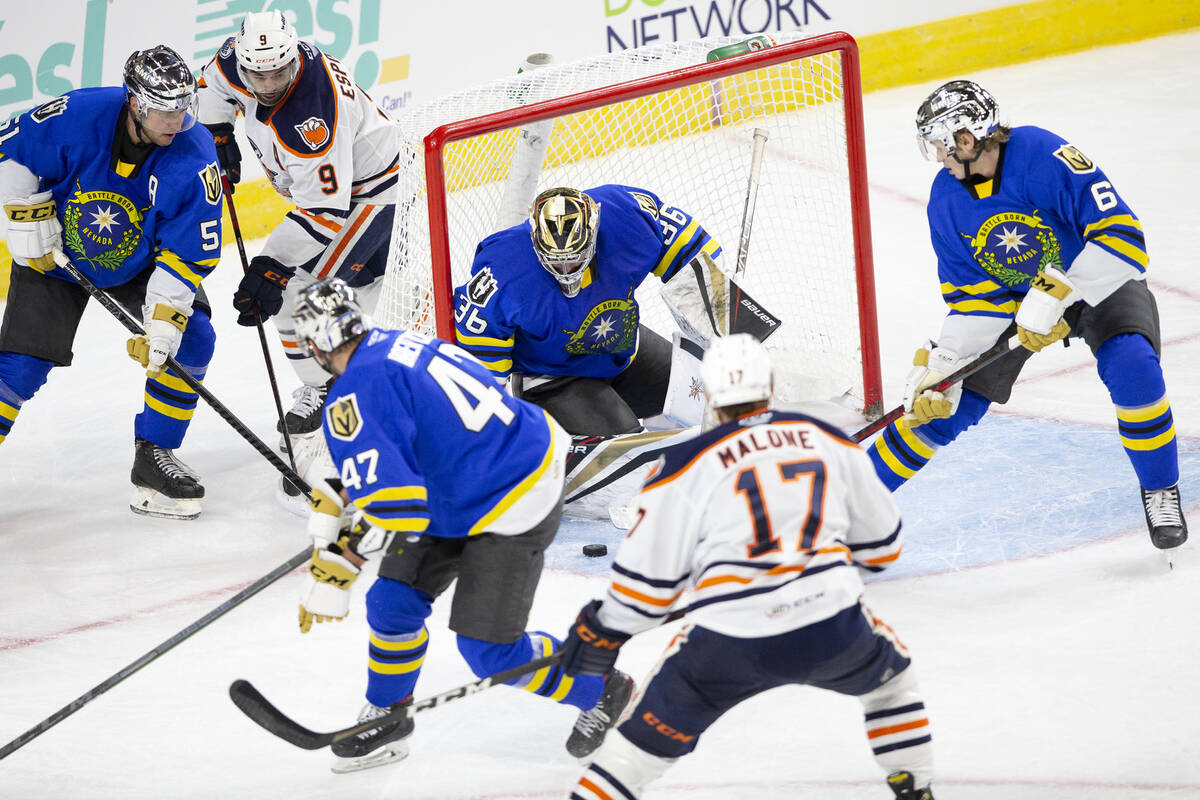 Henderson Silver Knights goaltender Logan Thompson (36) saves a shot on goal by Bakersfield Con ...