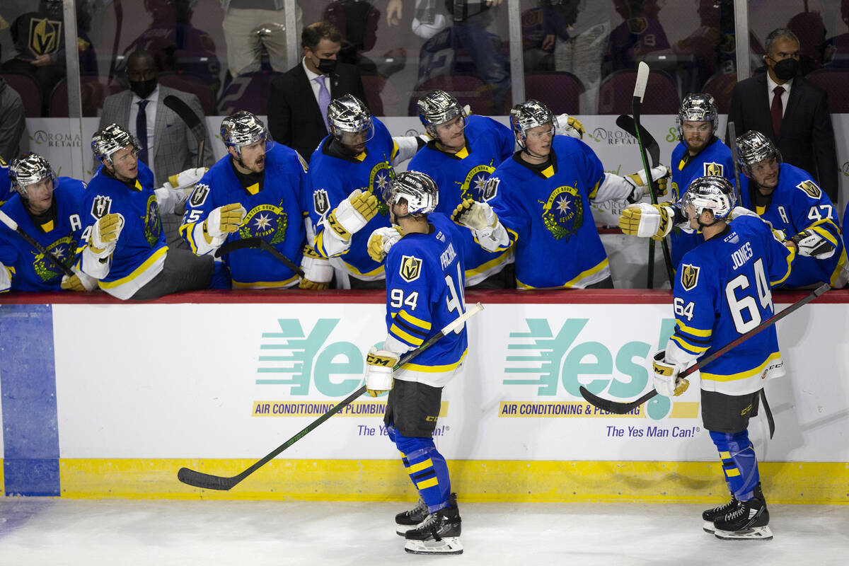 Henderson Silver Knights Brayden Pachal (94) is congratulated after scoring a goal on the Baker ...