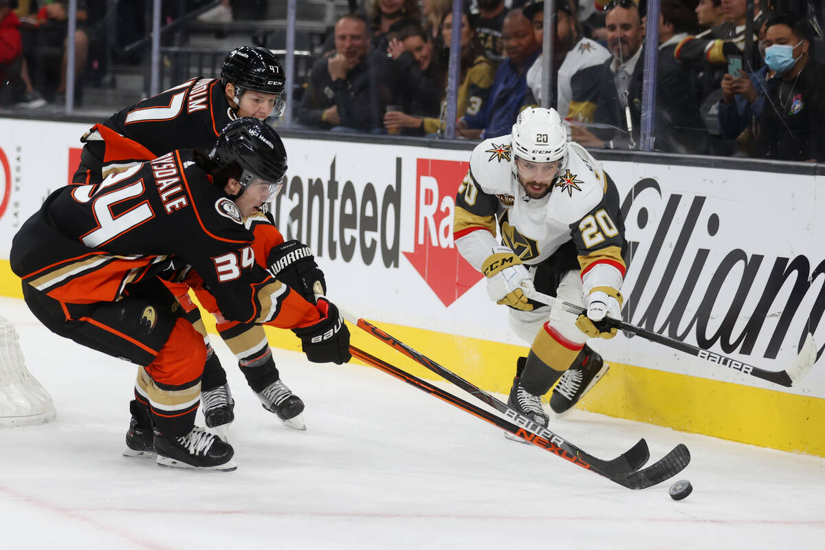 Vegas Golden Knights center Chandler Stephenson (20) fights for the puck against Anaheim Ducks ...