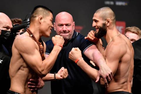 (L-R) Opponents Li Jingliang of China and Khamzat Chimaev of Chechnya face off during the UFC 2 ...