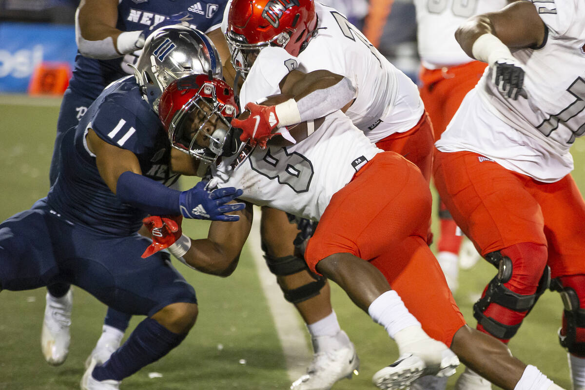 UNLV running back Charles Williams (8) runs for a touchdown against Nevada in the second half o ...