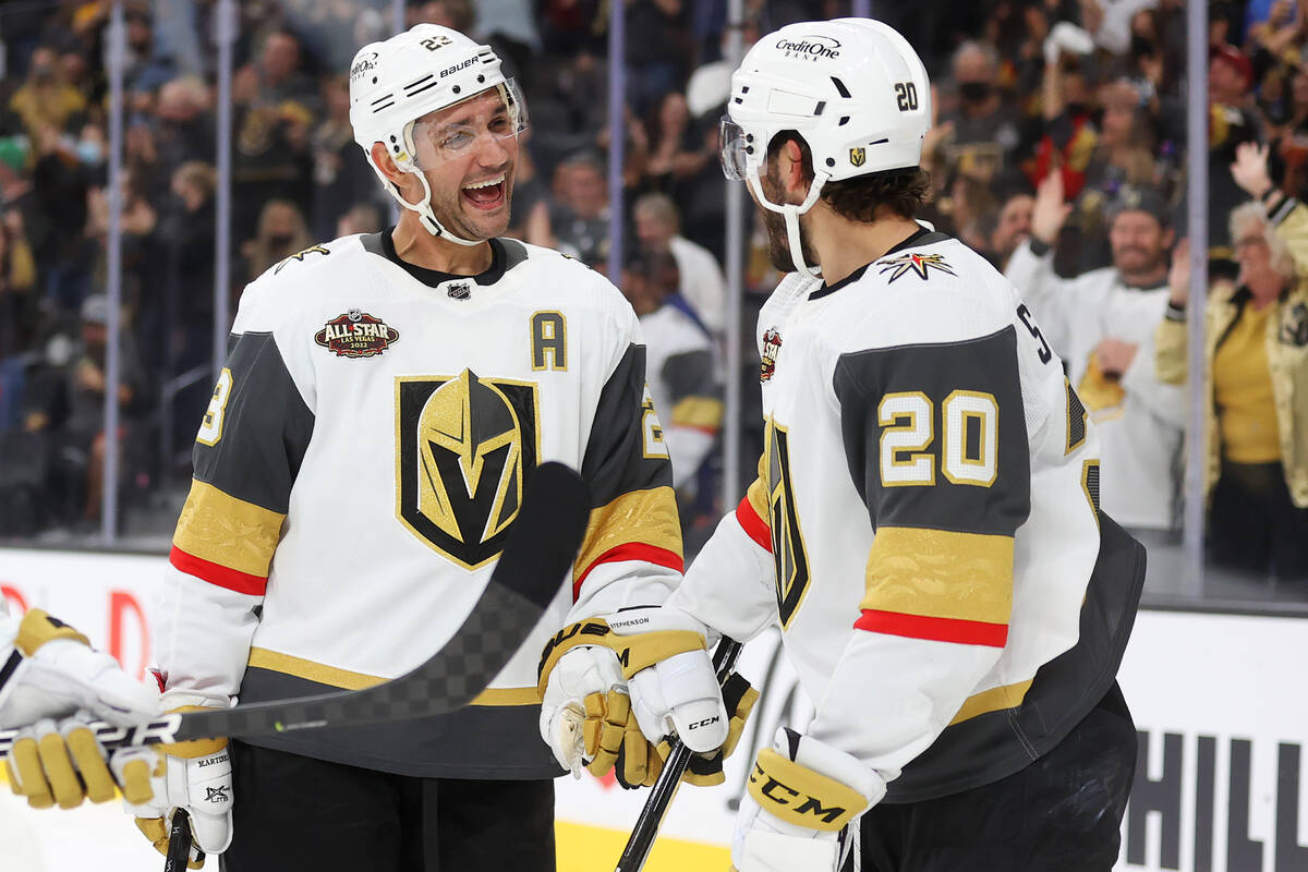 Vegas Golden Knights defenseman Alec Martinez (23) celebrates a score by left wing William Carr ...