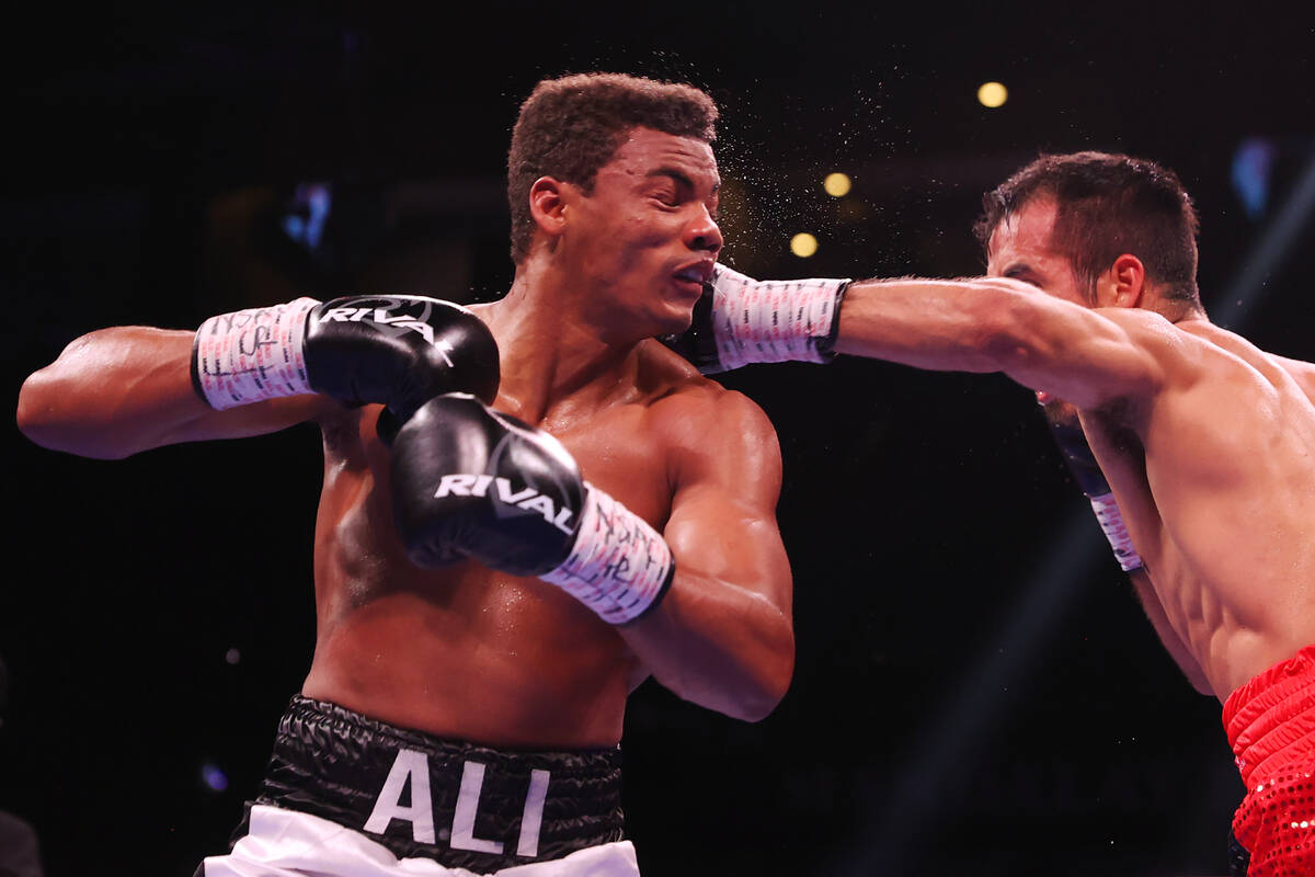 Jose Matias Romero, right, connects a punch against Michel Rivera, in the sixth round of a ligh ...