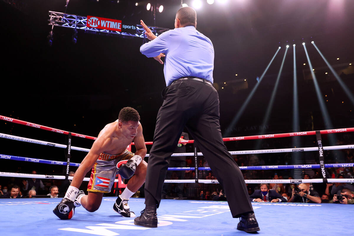 Thomas Dulorme is knocked out by Jaron Ennis in the first round of a welterweight bout at Miche ...