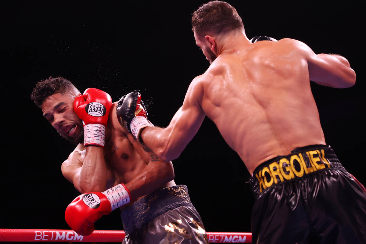 Radzhab Butaev, right, connects a punch against Jamal James in the third round of the WBA World ...