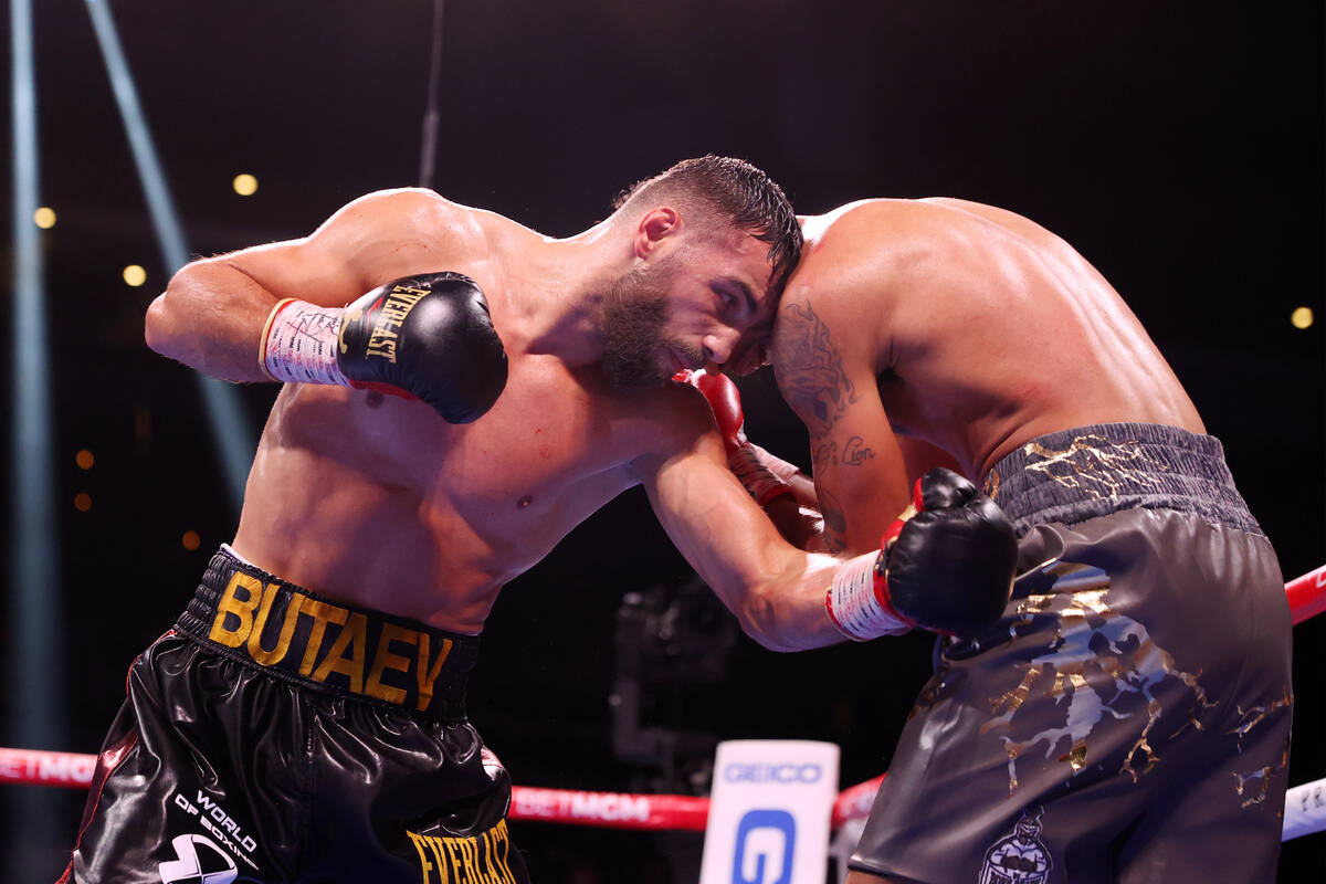 Radzhab Butaev, left, battles Jamal James in the sixth round of the WBA World Welterweight titl ...