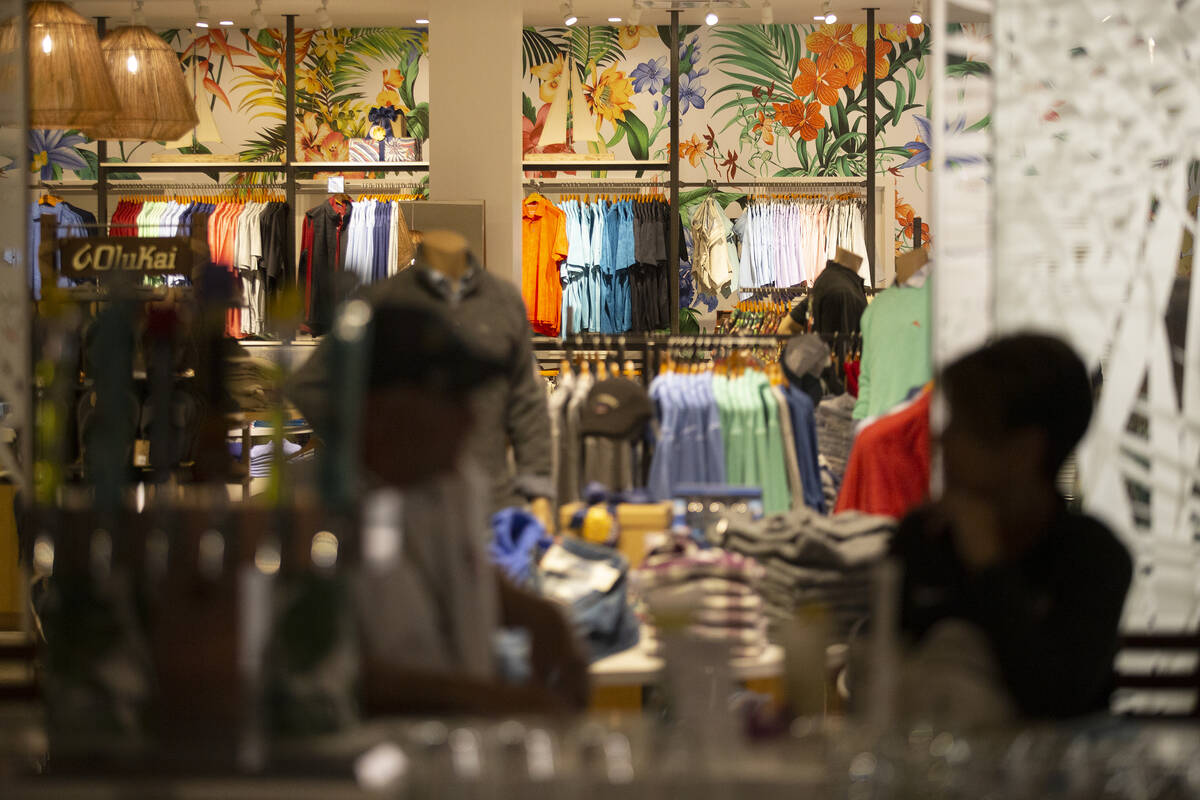 Diners sit at the bar in Marlin Bar while the Tommy Bahama store is open for business in Town S ...