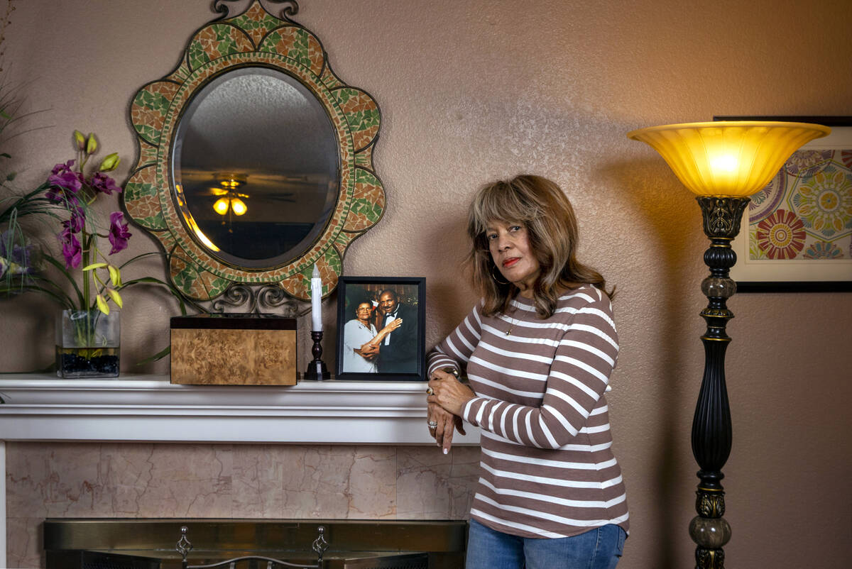 Sylvia Smith about a picture of her parents Geneva and George Woods on the fireplace mantel whe ...