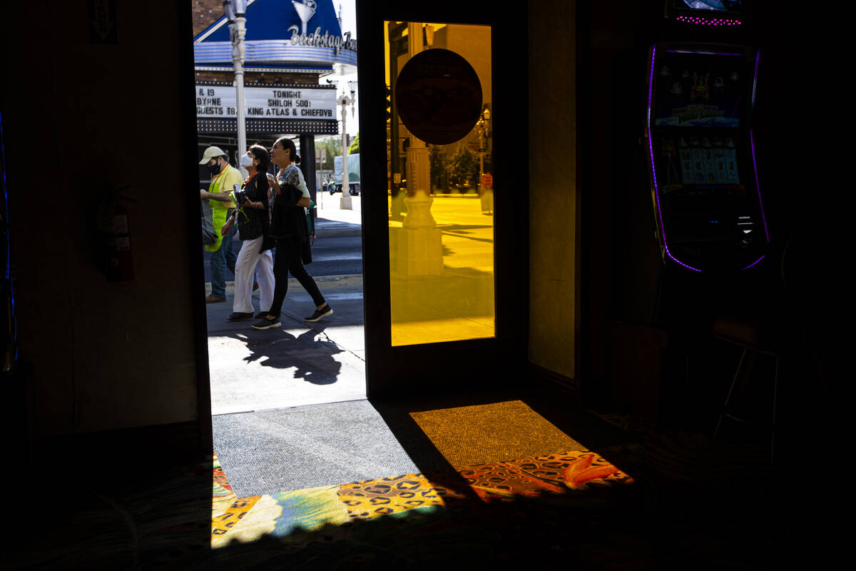 Pedestrians pass by a Fremont Street entrance to the El Cortez in downtown Las Vegas on Wednesd ...