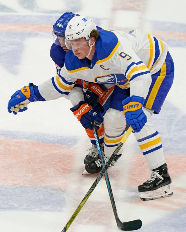 New York Islanders center Jean-Gabriel Pageau (44) defends Buffalo Sabres center Jack Eichel (9 ...