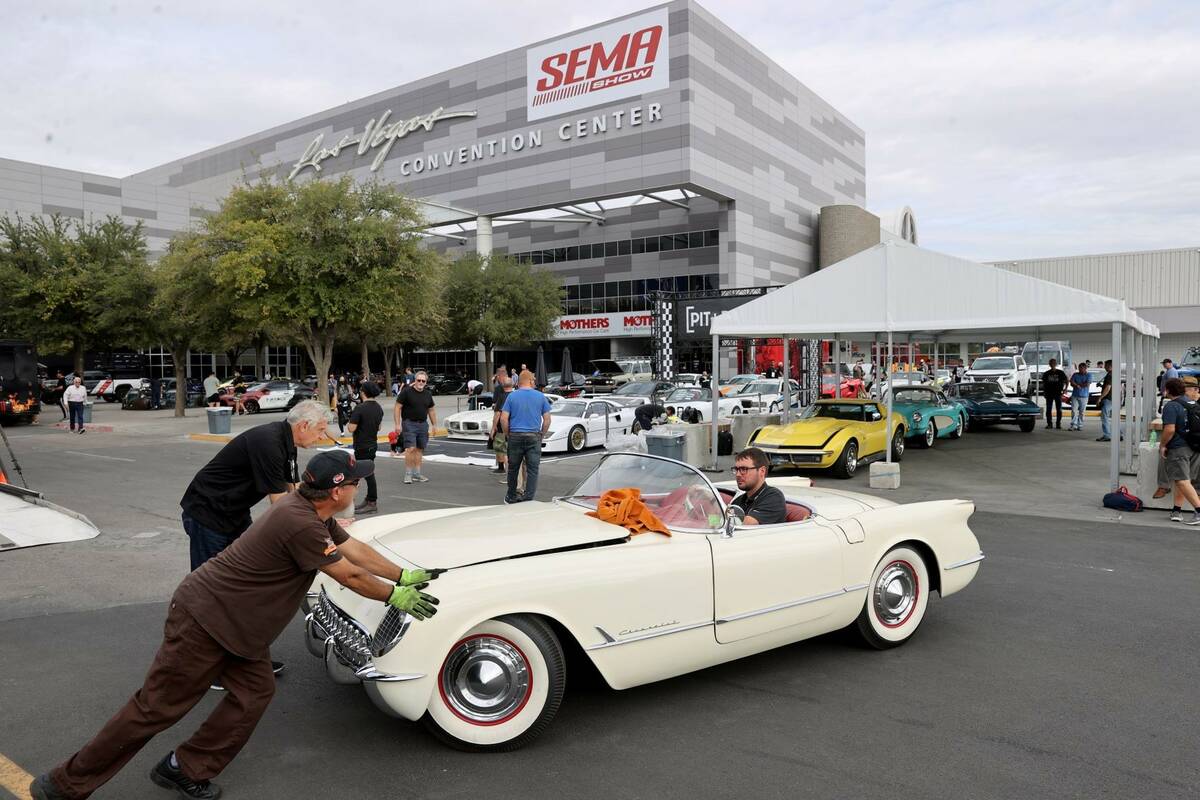 Workers unload a 1953 Corvette at the Las Vegas Convention Center Monday, Nov. 1, 2021, in prep ...