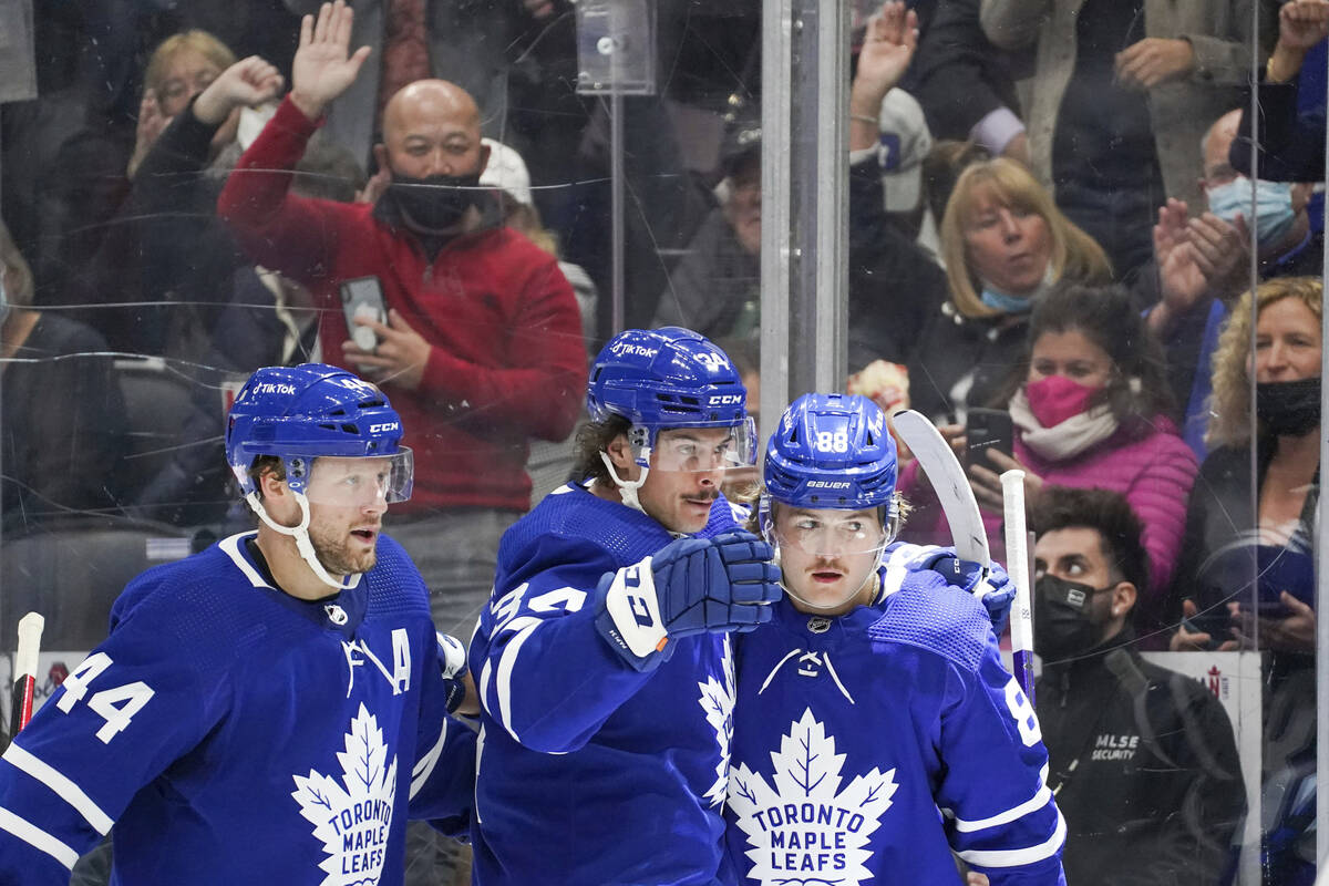 Toronto Maple Leafs' Morgan Rielly (44), Auston Matthews (34) and William Nylander (88) celebra ...