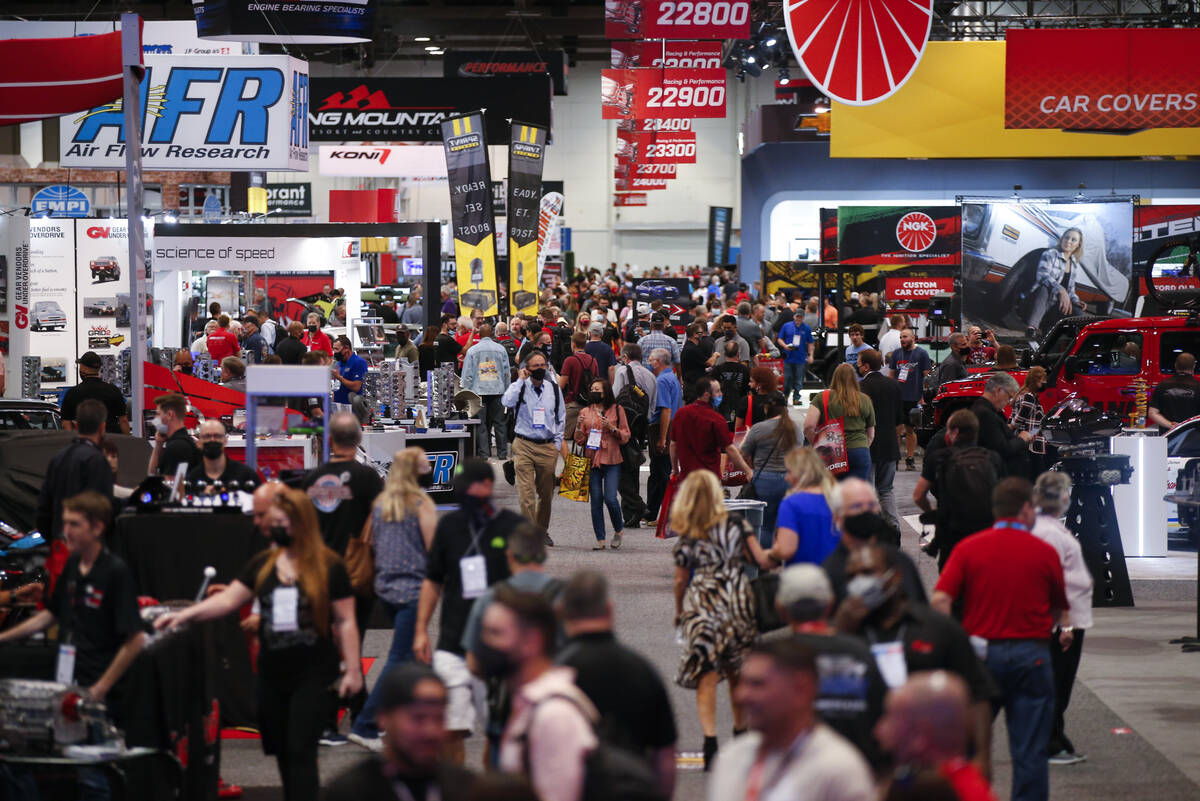 Attendees of the the Specialty Equipment Market Association, or SEMA, Show walk around inside o ...
