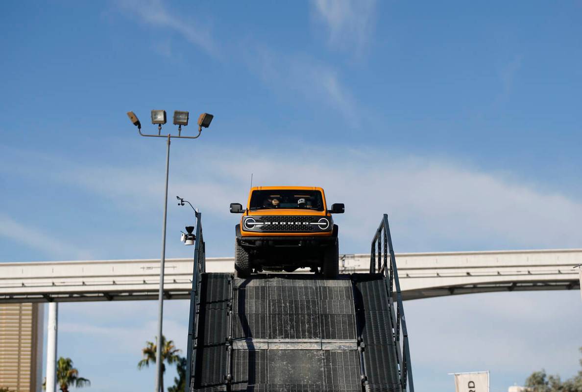 Attendees test drive a Ford Bronco during the Specialty Equipment Market Association, or SEMA, ...