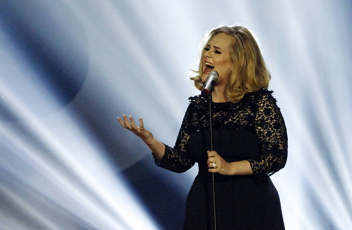 Adele performs during the Brit Awards 2012 at the O2 Arena in London, Feb. 21, 2012. (Joel Ryan ...