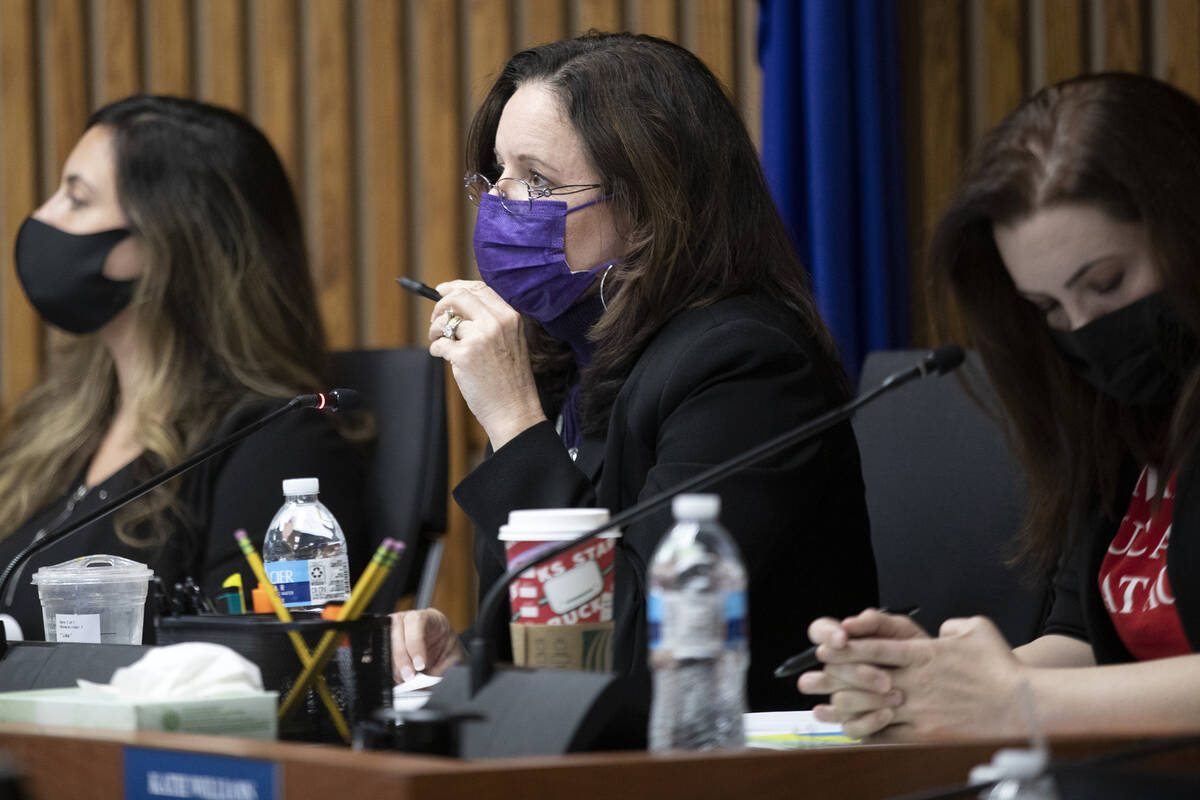 CCSD Board of Trustees member Lisa Guzman, center, speaks about the interim superintendent appo ...