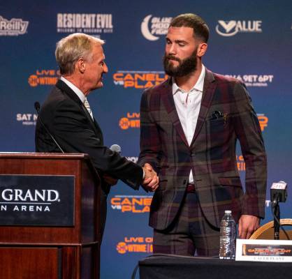 Boxing announcer Jimmy Lennon Jr., left, welcomes Caleb Plant to the stage during the final pre ...