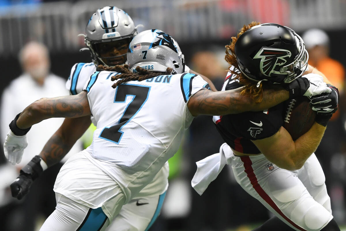 Carolina Panthers outside linebacker Shaq Thompson (7) hits Atlanta Falcons tight end Hayden Hu ...