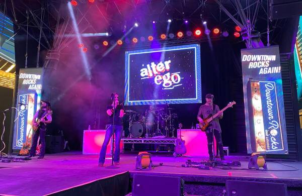 Rock cover band Alter Ego performs on the Fremont Street Experience's 1st Street Stage early mo ...