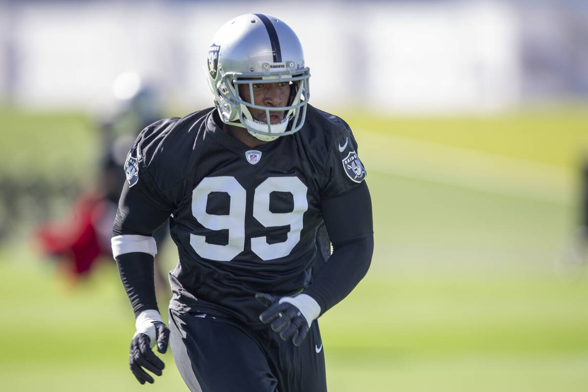 Raiders defensive end Clelin Ferrell (99) runs on the field during a practice session at the Ra ...