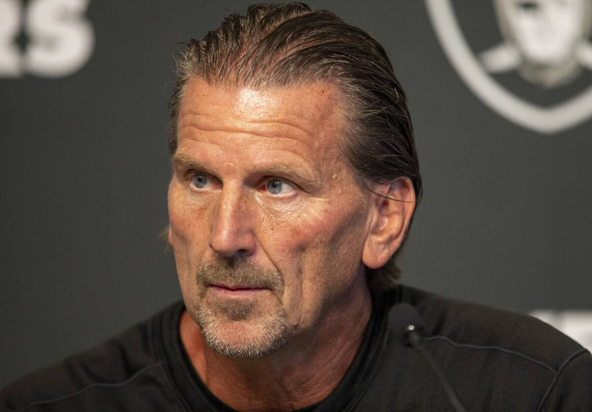 Raiders offensive coordinator Greg Olson listens to media questions during a practice session a ...