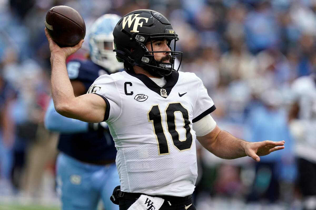 Wake Forest quarterback Sam Hartman (10) passes against North Carolina during the first half of ...