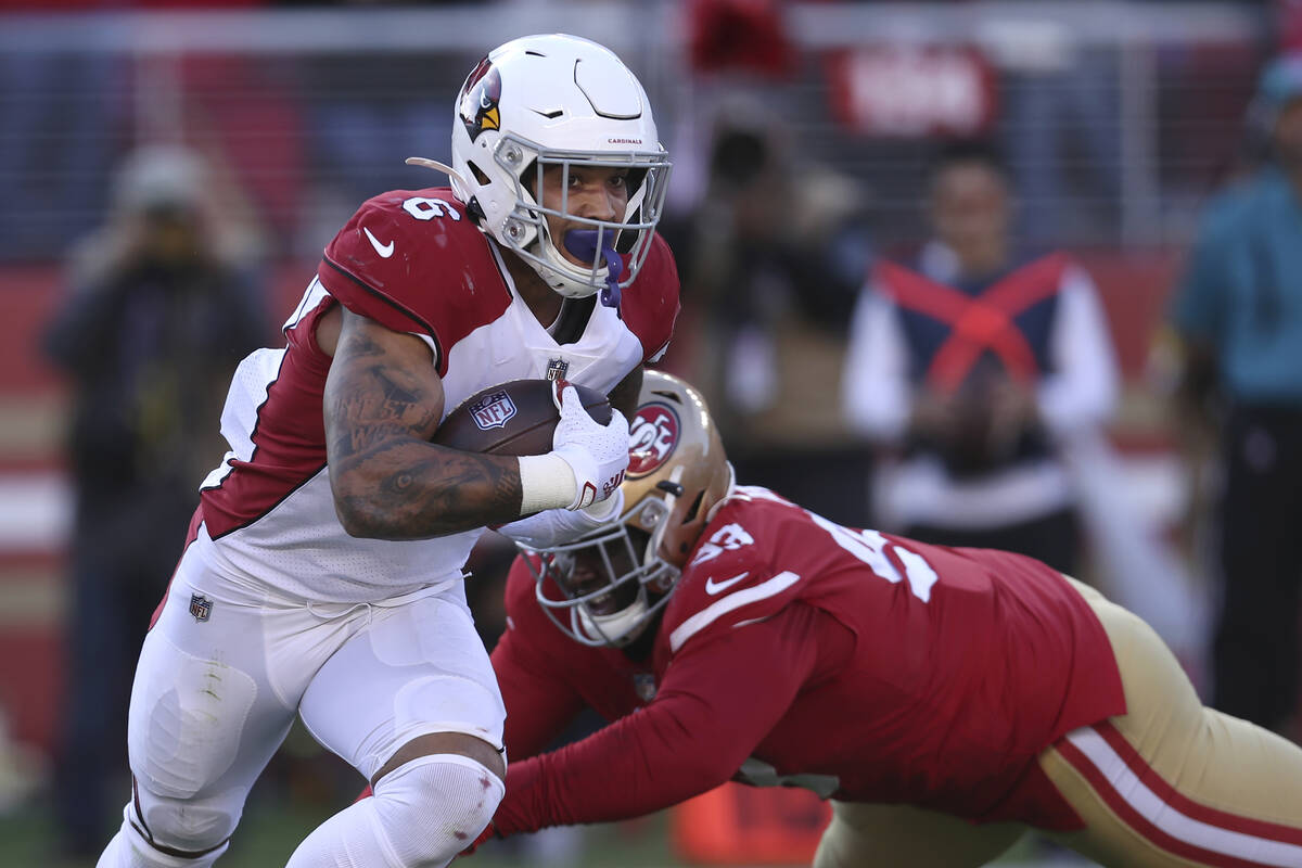 Arizona Cardinals running back James Conner (6) runs past San Francisco 49ers defensive tackle ...