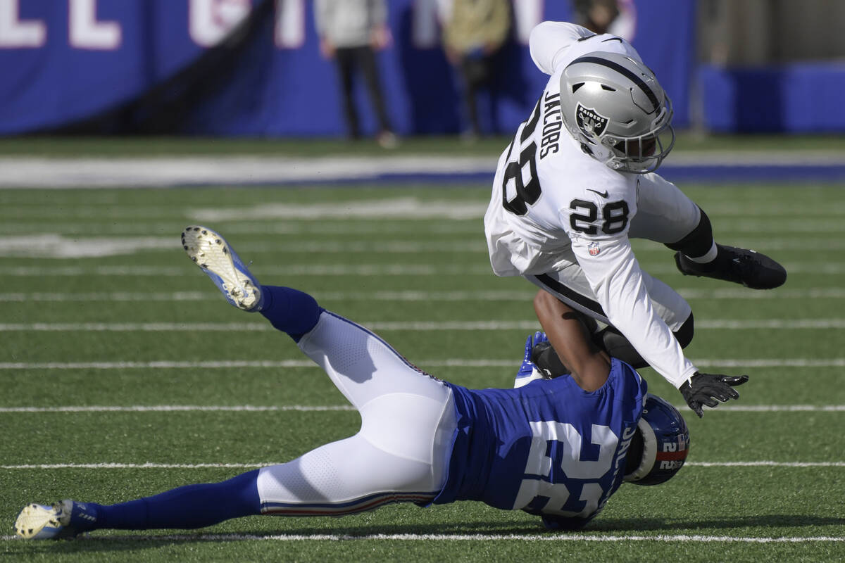 New York Giants' Adoree' Jackson (22) tackles Las Vegas Raiders' Josh Jacobs (28) during the fi ...