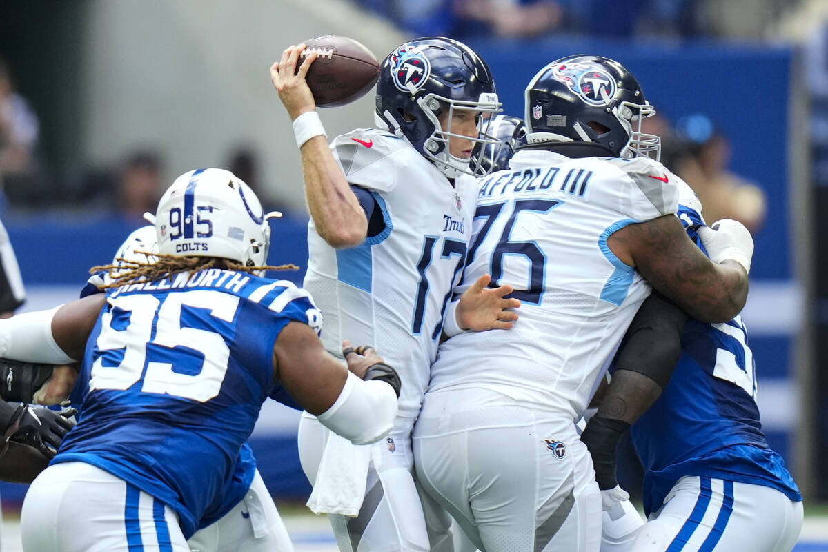 Tennessee Titans quarterback Ryan Tannehill (17) is sacked by Indianapolis Colts defensive tack ...