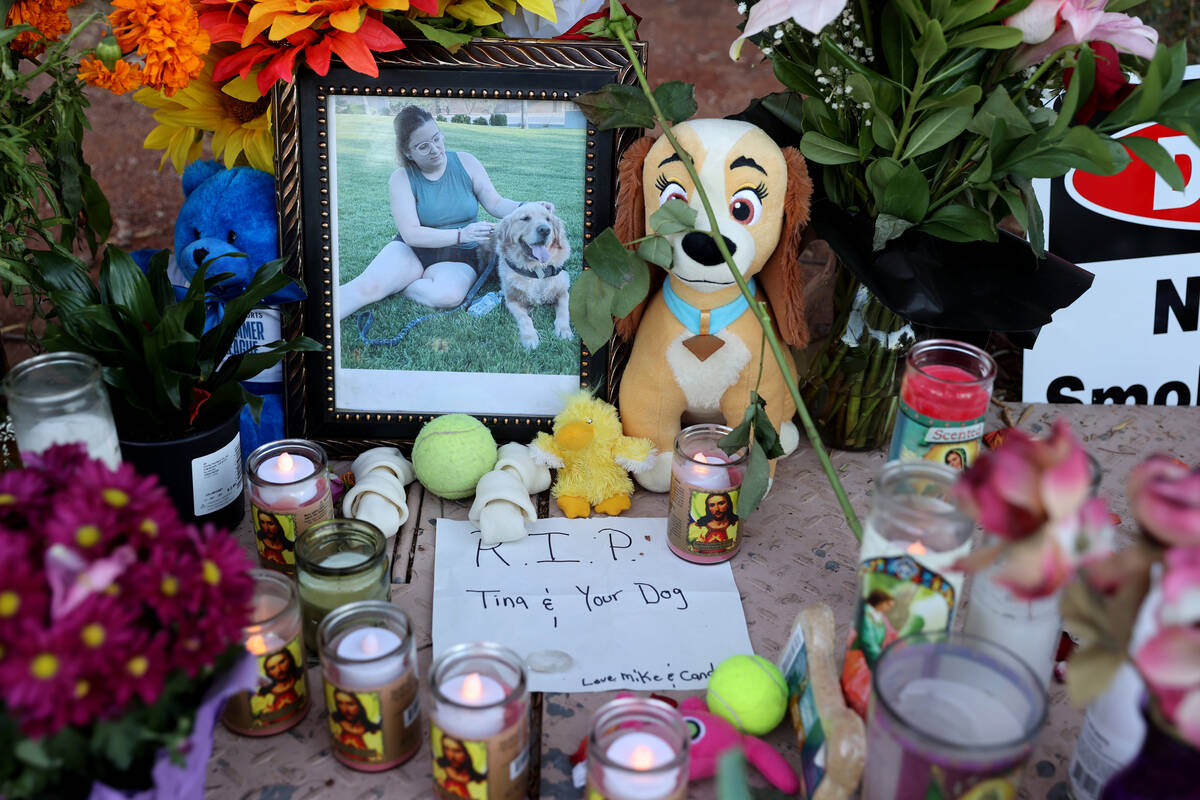 A photo of Tina Tintor and her dog, Max, in a memorial at Rainbow Boulevard and Spring Valley P ...