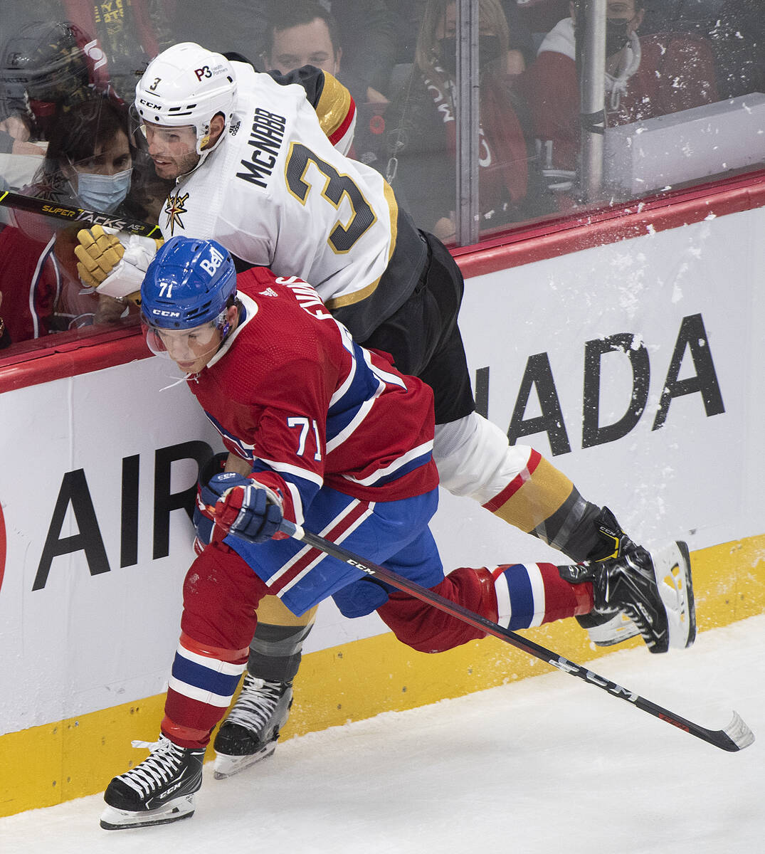 Montreal Canadiens' Jake Evans (71) checks Vegas Golden Knights' Brayden McNabb during first-pe ...