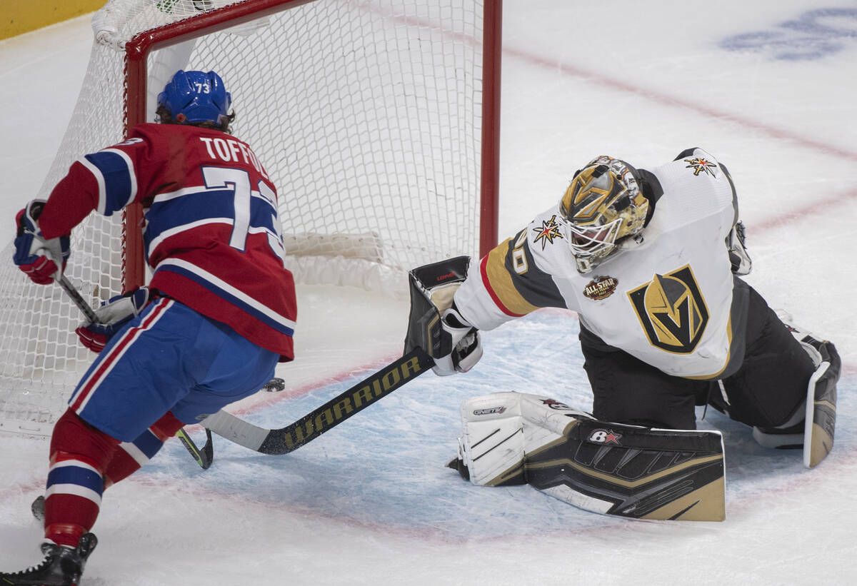Montreal Canadiens' Tyler Toffoli, left, scores against Vegas Golden Knights goaltender Robin L ...