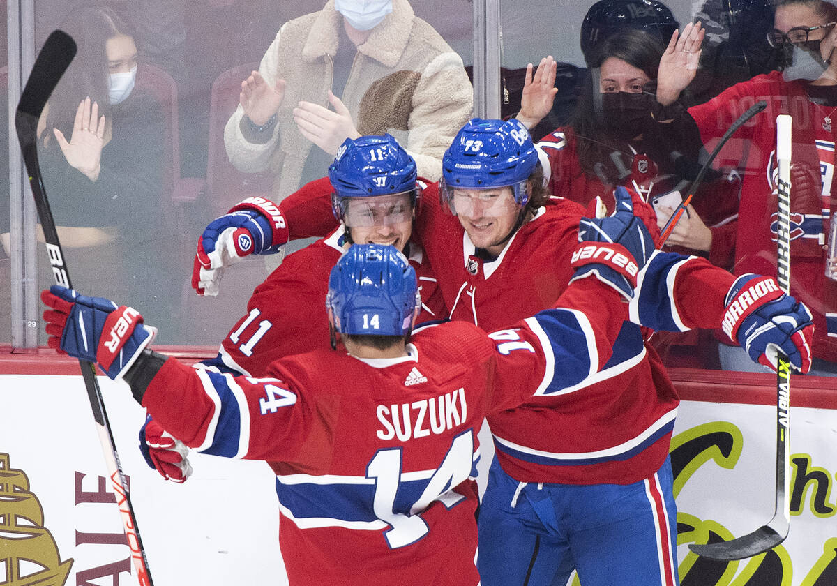 Montreal Canadiens' Tyler Toffoli (73) celebrates with teammates Brendan Gallagher (11) and Nic ...