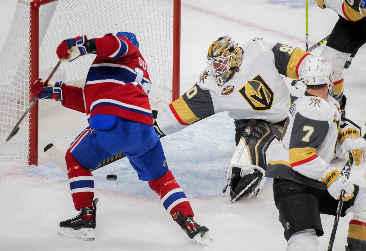 Montreal Canadiens' Nick Suzuki, left, scores against Vegas Golden Knights goaltender Robin Leh ...